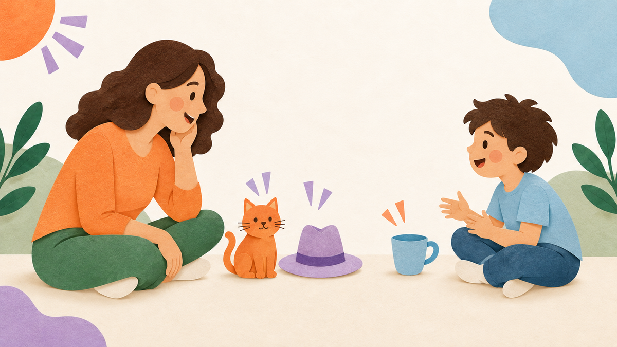 A parent and child play a spoken rhyme game with cat and hat paired together and cup set apart.